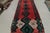 Originating from Morocco in the 1950s, this vintage midcentury Moroccan wool rug symbolizes strength, protection, and...