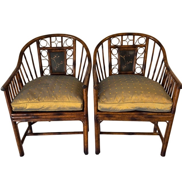 A striking pair of Theodore Alexander faux bamboo Pavilion-style armchairs featuring elegant Chinoiserie influences...
