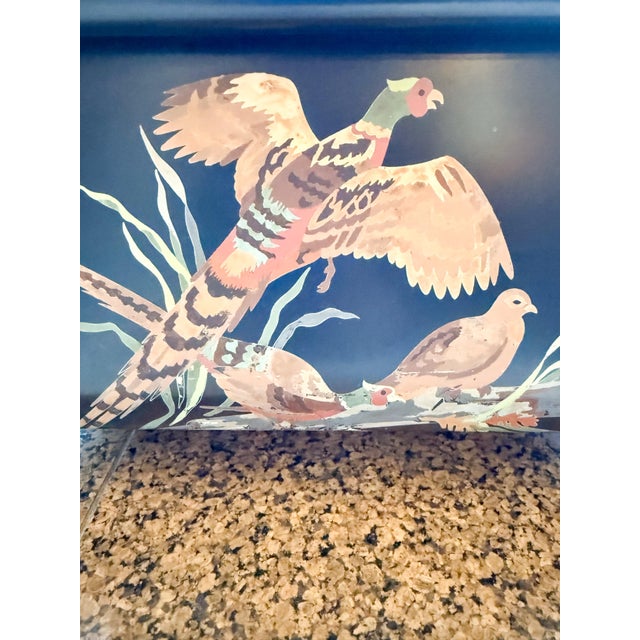 A striking vintage tole magazine rack featuring a beautifully hand-painted trio of pheasants in a lush meadow. The deep...
