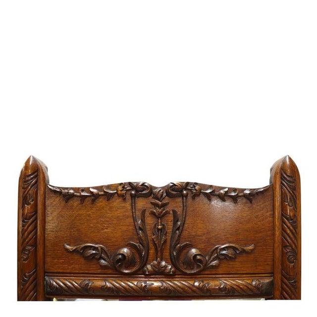 An antique cheval dressing mirror, crafted from carved oak in the distinctive style of R.J. Horner, dating to...