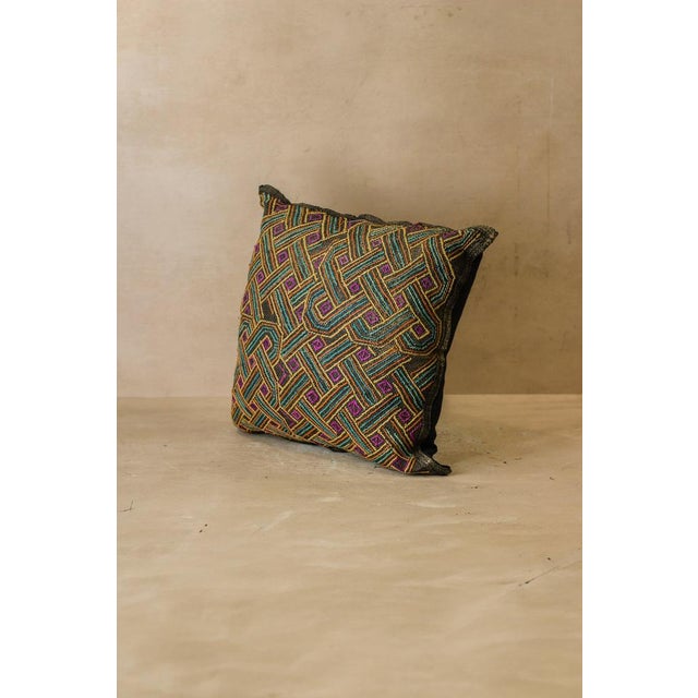 A beautifully hand stitched textured cushion made from the fiber of the Raffia Vinifera Palm in the Democratic Republic of...
