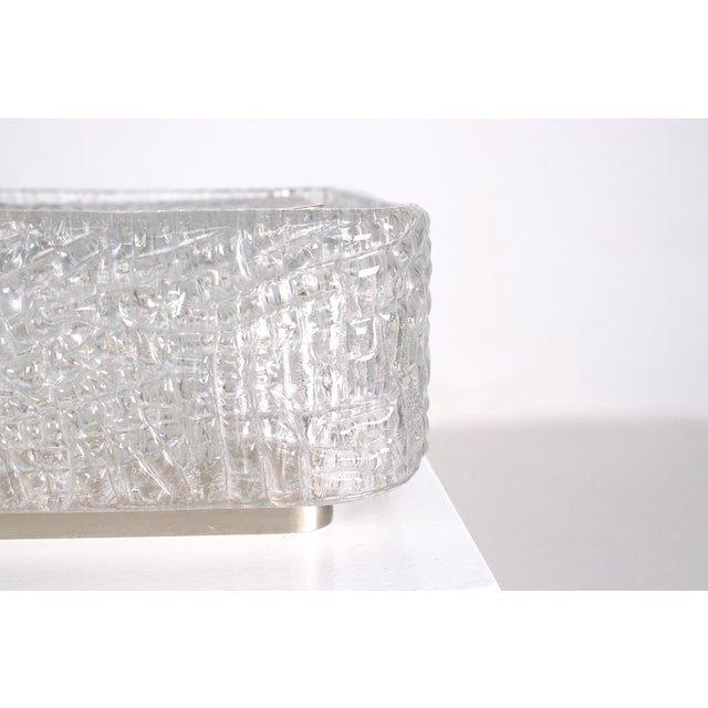 Kaiser leuchten ceiling light from the 1970s, made of pressed glass with a highly textured grain, framed in a square frame...