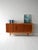 Sideboard in teak and oak with six drawers and two sliding doors. Round carved handles and double essence. Made between...