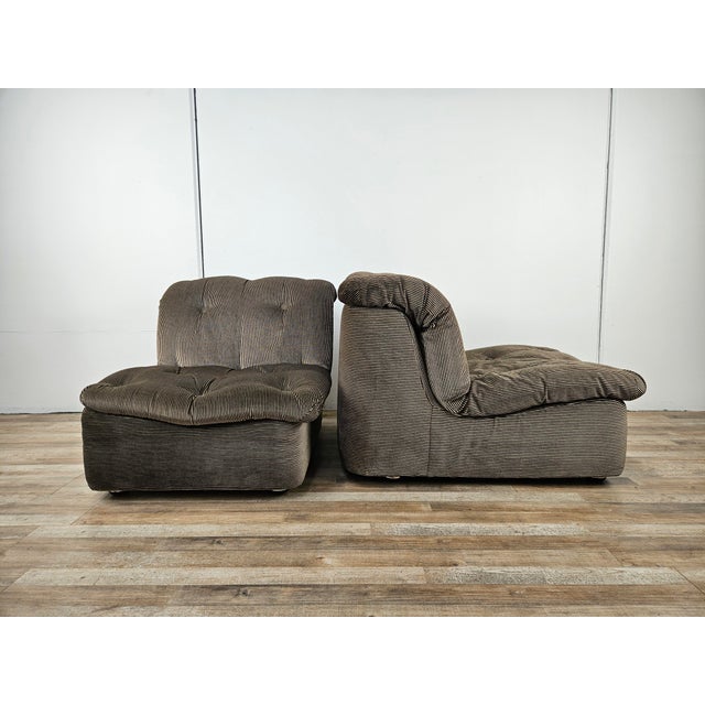 Pair of vintage Italian armchairs from the early 1970s entirely upholstered in striped fabric with metal and plastic feet....