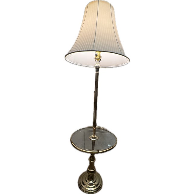 Vintage Mid-Century Modern Solid Brass Floor Lamp featuring an integrated round glass tray table. Combining functional...