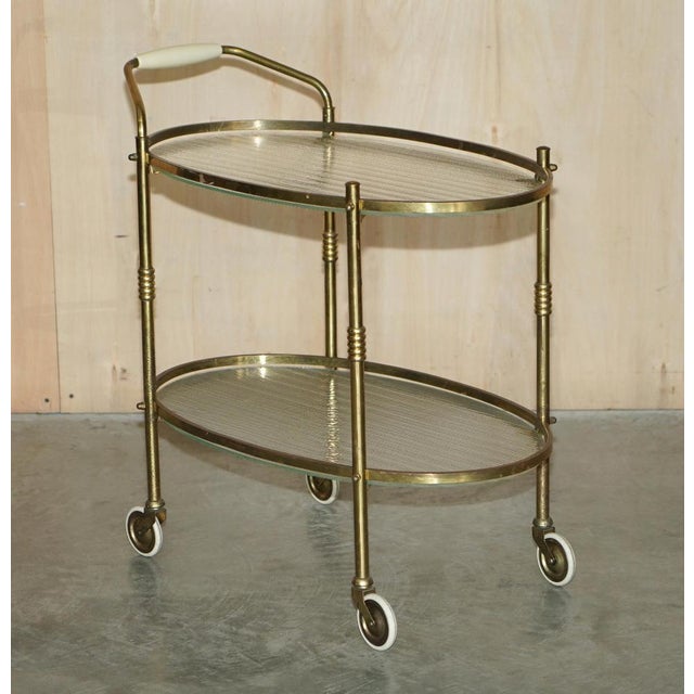 This is a Art Deco circa 1920's brass and frosted glass drinks trolley circa 1920 A good looking well made and decorative...