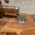 Weathered Brown Vintage Suitcase With Metallic Latches Industrial For Sale - Image 9 of 16
