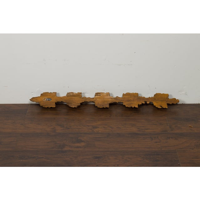 A pair of Italian carved wooden wall carvings from the late 19th century, depicting pomegranates. Created in Italy during...