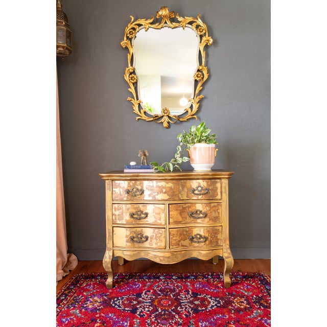 A beautifully distressed American-made, French-influenced antique commode by Chittenden & Eastman Company of Burlington,...