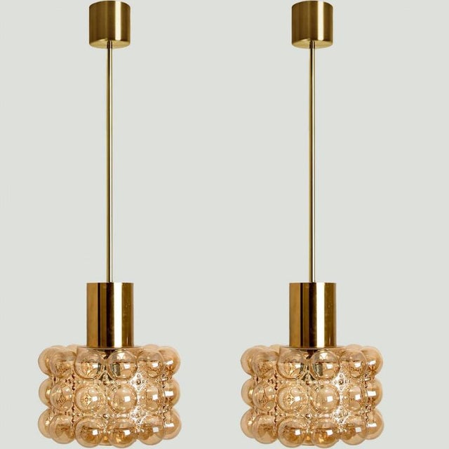 Several bubble glass pendant light designed by helena tynell for glashütte limburg. A design classic, the hand blown glass...