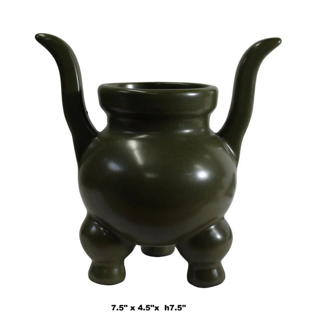 This is a handmade ceramic round shape ding shape incense holder / container with a simple clean flat surface. It has a...