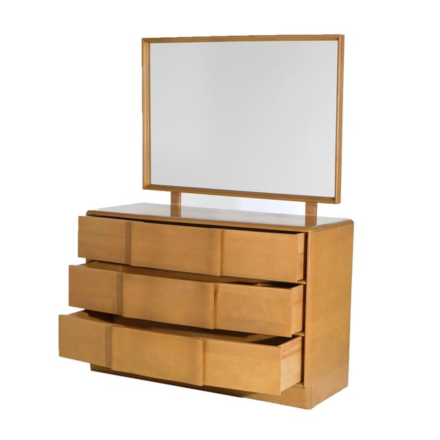 Mid Century Modern Heywood Wakefield Dresser & Mirror offers Birch Construction in Wheat Finish with Three Long Drawers,...