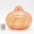 Hand-blown Filigrana vase with vivid orange and red threads suspended in clear glass. The rounded body and narrow neck...