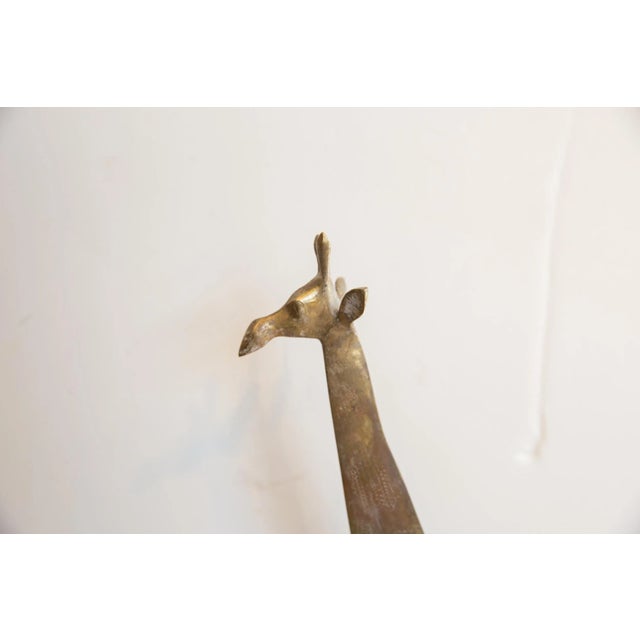 :: Vintage handmade African giraffe. Made approximately 40-70 years ago, each figure in this collection represents a...