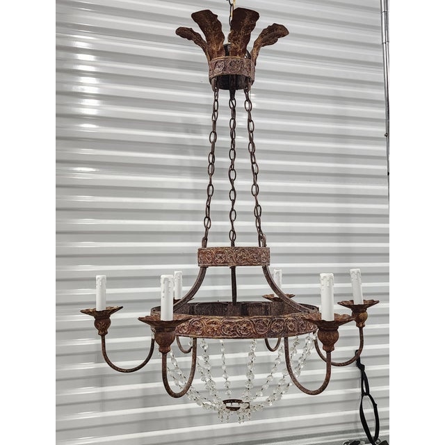 This iron and crystal chandelier was the 1st design produced by Nierman Weeks, inspired from a chandelier in a whitewash...