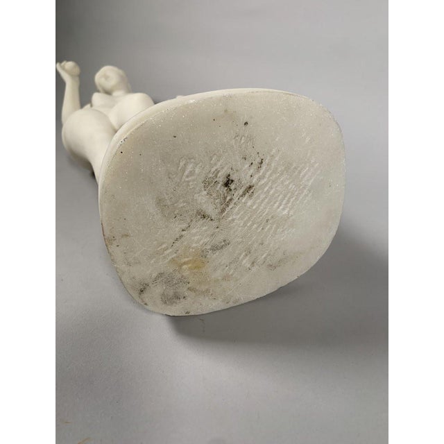 A 19th-century white marble sculpture depicts Venus with an apple, after Bertel Thorvaldsen (1770-1844). She holds an...