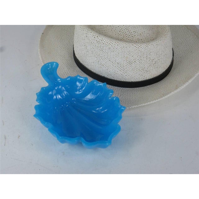 This vintage "French Blue" glass leaf mouth-blown candy dish from the 19th century is a beautiful and elegant addition to...