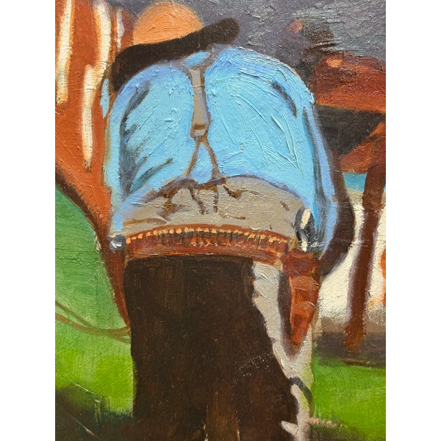 A moment of quiet connection unfolds under dark, summer skies. One rider, relaxed in a vivid red shirt, sits astride a...