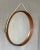 Round vintage mirror 1960s, Italian manufacture. The mirror has a teak frame along the entire circumference with a rope...