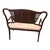An elegant early 20th-century Federal/Neoclassical Revival two-seat settee distinguished by its graceful silhouette and...
