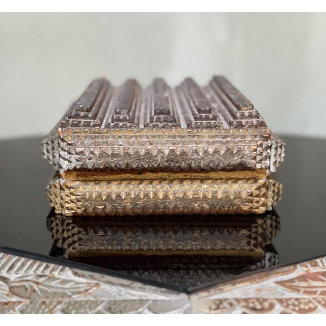 Another handsome chip-carved tramp art box. This one has silver and gold painted on the exterior, and silver paint on the...