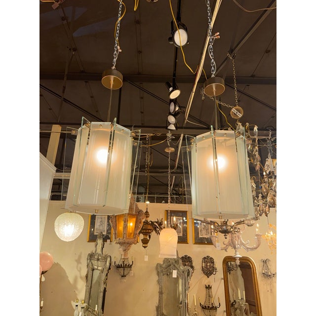 This product is a pair of Italian modern pale green frosted glass lanterns, perfect for adding a touch of elegance and...