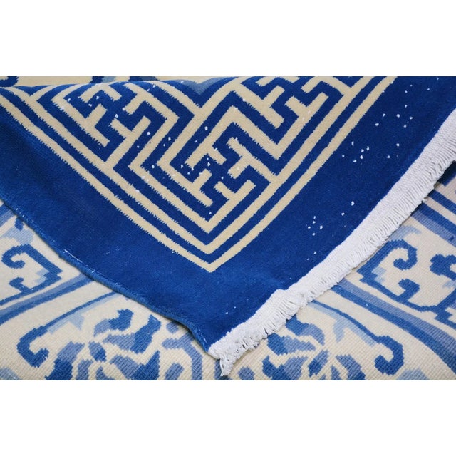 Hand-knotted with care using traditional rug-making techniques, this wool rug blends timeless craftsmanship with a modern...