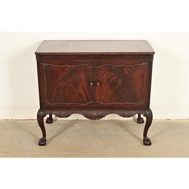 An exceptional antique Chippendale or Georgian style sideboard, buffet server, or bar cabinet By Romweber USA, Circa 1920s...