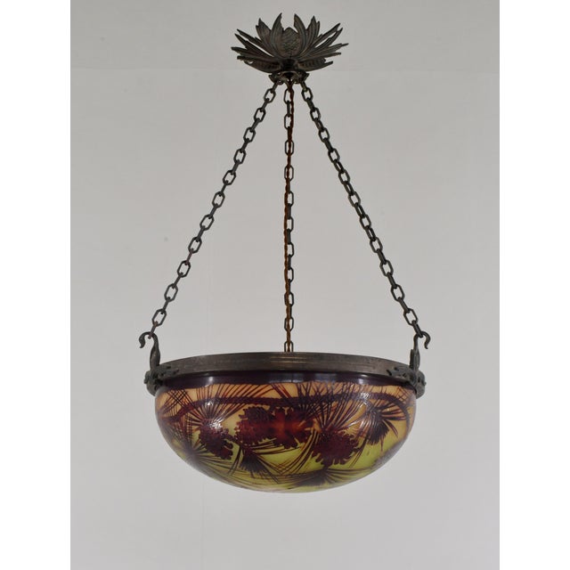 établissement Émile Gallé A French art deco hanging fixture in patinated bronze with a Gallé bowl in acid-engraved cameo...
