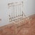 This iron outdoor armchair is an authentic example of vintage garden furniture, featuring a worn, industrial aesthetic...