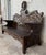 Early 20th century Spanish bench made from oak. The back is exquisitely hand carved with two differents motifs, surrounded...
