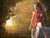 In "Edge of Oblivion," a serene figure in a polka-dotted dress sits contemplatively, bathed in warm, golden light that...