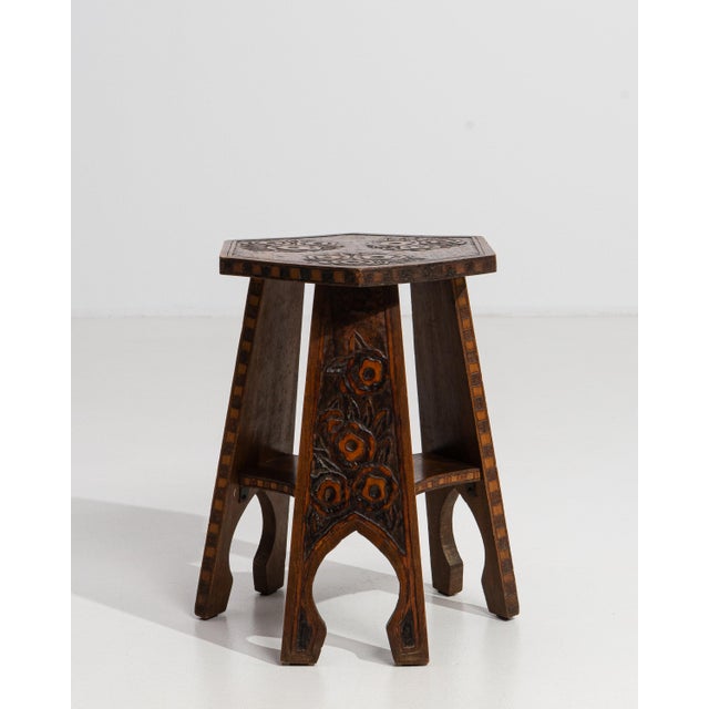 A masterfully carved wooden stool of Oriental inspiration, this striking French piece from the twentieth century bridges...