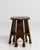 A masterfully carved wooden stool of Oriental inspiration, this striking French piece from the twentieth century bridges...