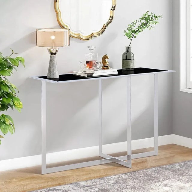 Introducing our stunning Luxe modern glass console: a masterpiece of contemporary design that seamlessly blends elegance...