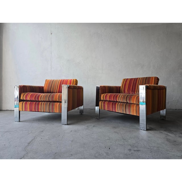 A striking pair of 1970's chrome Mid-Century lounge chairs by Milo Baughman featuring original jack Lenor larsen mico...