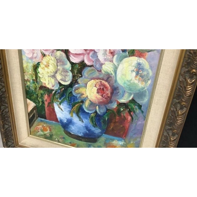 A vibrant Impressionist-style floral still life featuring a lush bouquet of peonies and roses arranged in a cobalt blue...