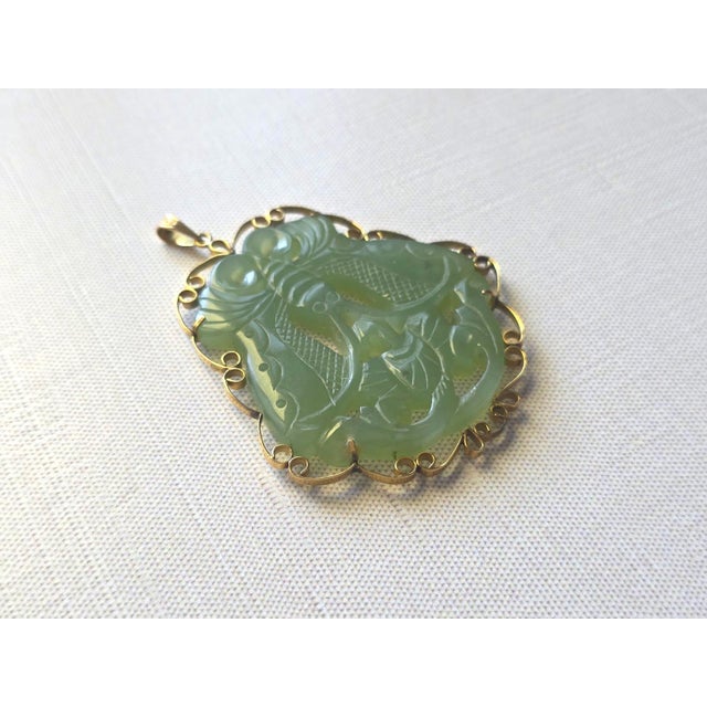 This is an amazing antique hand-carved yellowish-green serpentine pendant that was decorated in 585 (14k) gold around the...
