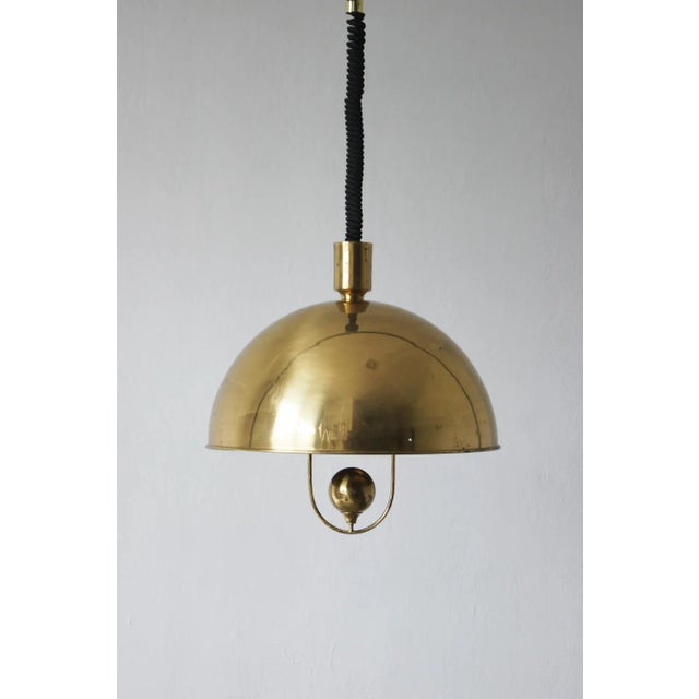 Minimalist, elegant, and sophisticated—this hemispherical pendant lamp by Florian Schulz is the essence of mid-20th-...