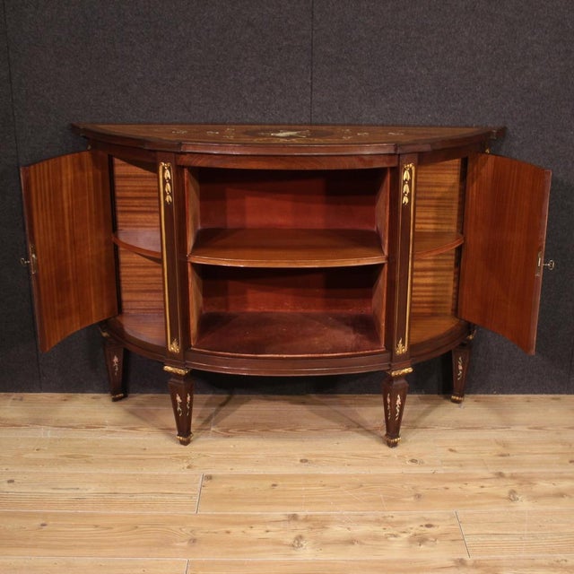 Elegant Italian half moon sideboard from the mid-20th century. Richly inlaid Louis XVI-style cabinet in mahogany, walnut,...