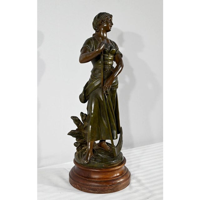 Regula with green and brown patina, entitled "Faucheuse", titled and signed on the terrace by the French sculptor A-J...