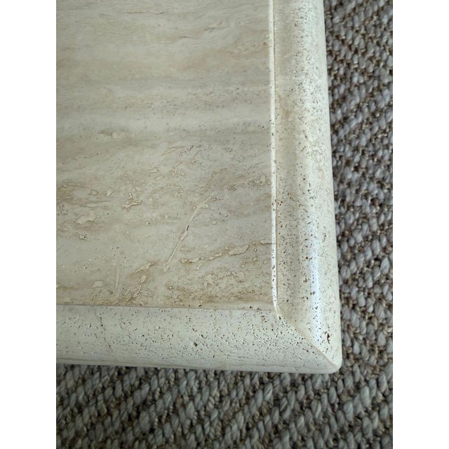 Vintage Square Travertine Coffee Table A cool stone table with a distinct edge and cube base. 39” sq x 16” h