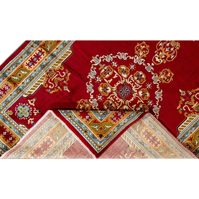 Beautiful vintage Persian hand-knotted wool rug with a red field. This piece has a multi-color accent in an all-over...