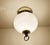Vintage Limburg flush light, featuring globe glass shade mounted on a brass base with ring finial. Very good condition....