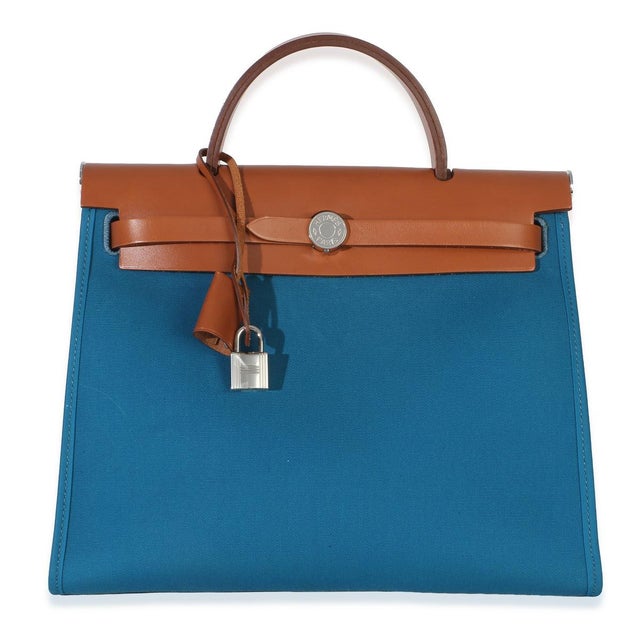 Item #: 154710 Exterior Material: Canvas Size: 31 Interior Material: Canvas Dimensions: 12 x 9.5 x 4 in Handbag Closure...