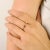 Elegant in its simplicity, this delicate band ring is crafted in luxurious 14k yellow gold and showcases a richly colored...