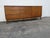 This high quality Dresser is made of wood, walnut, laminated, and veneer. The Dresser was made by American of Martinsville...