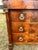 An elegant 19th-century French Empire commode crafted in richly figured flame mahogany veneer. Featuring three spacious...