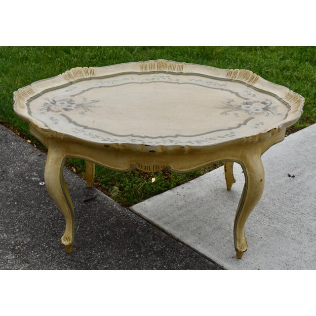 Vintage (1950's) Cocktail Table has a Venetian Style - Distressed Finish. Painted. The Table is Made of Wood. Oval Shaped....