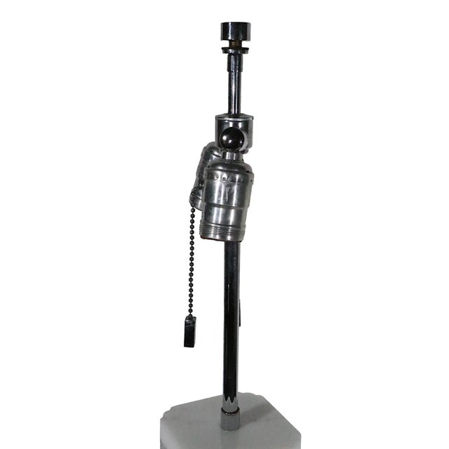 Classic 1970/1980's cast lucite table lamp, having a body of solid transparent lucite, with an opaque white lucite cap....